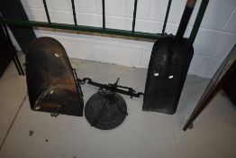 A vintage coal shovel (possibly railway or furnace related) and balance scale parts