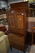 A fine Edwardian mahogany and inlaid cabinet of slender proportions having three drawer base on