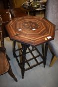 A 19th Century marquetry occasional table having octagonal top and interesting turned frame