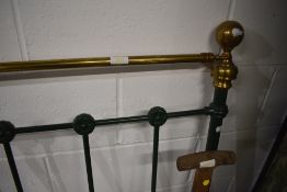 A reproduction metal bed head with brass knobs and top rail, width approx. 137cm (4ft 6in)
