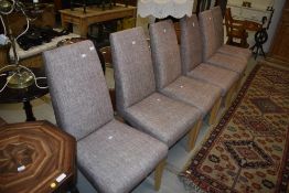 A set of six modern upholstered dining chairs