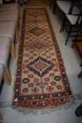 A traditional carpet runner, approx. 330 x 82cm