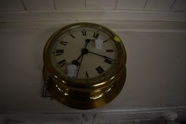 A brass ships style clock, diameter approx. 18cm