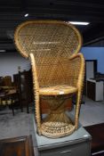 A vintage wicker peacock chair