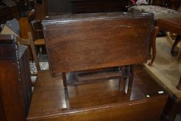 An early 20th Century oak Sutherland stytle table of small proportions, significant damage to veneer