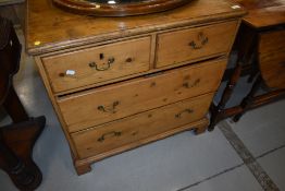 A 19th Century stripped chest of two over two drawers having drop handles and bracket feet, lovely
