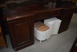 A Victorian mahogany sideboard , having rosette to central frieze drawer (no back), width approx.