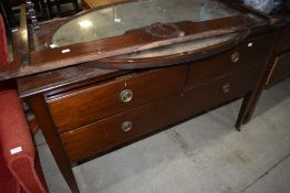 An early 20th Century mahogany chest of drawers, with rail and mirror to convert back to dressing