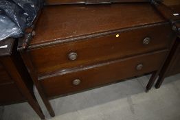 An early 20th Century oak chest of drawers, with rails to convert back to dressing table if required