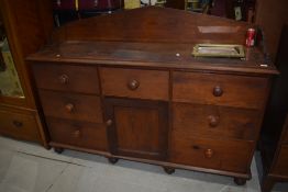 A Victorian stained pitch pine ledge back sideboard of simplistic form, width approx. 168cm