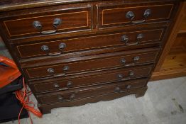 A reproduction regency shallow hall or similar chest of two over four drawers