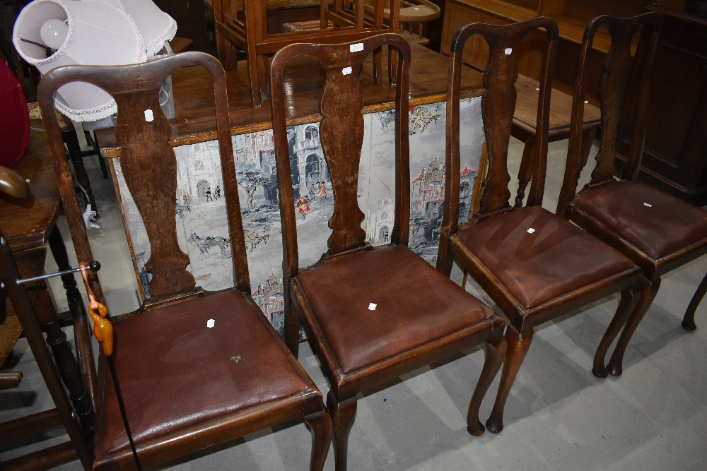 A set of four early 20th Century Queen Anne style vase back dining chairs