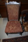 A 19th Century stained frame high back low seat chair