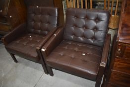 A pair of vintage buttoned brown vinyl easy chairs having wood frames, width each approx. 68cm