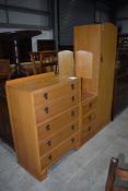 An early to mid 20th Century golden oak and ply two piece bedroom suite comprising single robe