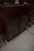 A 19th Century mahogany bookcase top, having astral glazed doors, width approx. 114cm