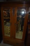 A late Victorian wardrobe having double mirror doors and Art Nouveau style detailing , width approx.