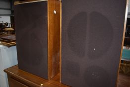 A pair of large vintage speaker cabinets fitted with woofers and tweeter