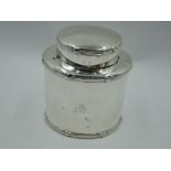 An Edwardian silver travelling tea caddy of plain form having reed and cross border, Birmingham