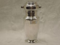 A silver plated Art Deco MIXIT cocktail shaker having rotating list of cocktail recipes in the
