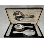 A cased silver 5 piece dressing table set of plain form bearing monogram to backs (missing comb),