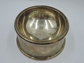 A silver trencher salt of plain circular form having oversized 1934 jubilee hallmarks to the