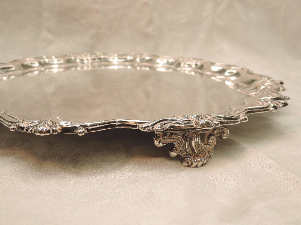 An Edwardian silver salver of circular form having raised pie crust rim with floral decoration, - Image 2 of 4