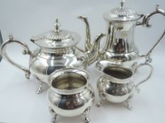 A four piece silver plated tea set of plain circular form having hoof feet