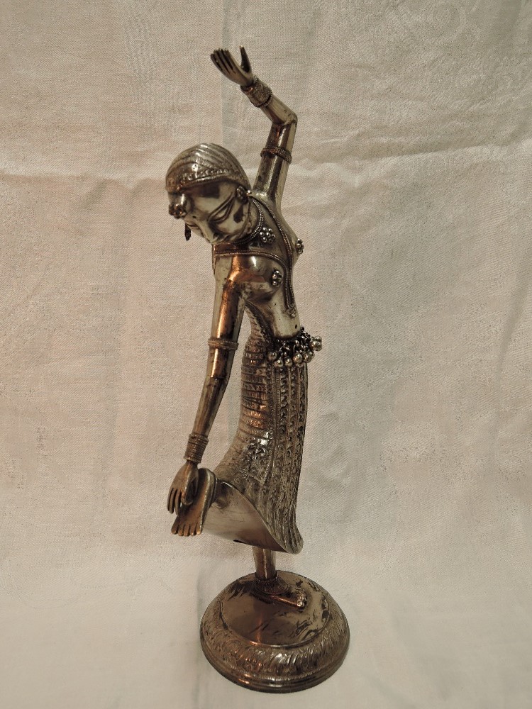 A white metal study of a Far Eastern dancing figurine having moulded and engraved decoration on a - Image 2 of 5