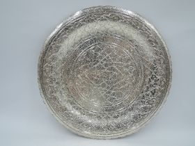 A mid 20th century Egyptian silver plate having shaped rim, extensive engraved decoration and '