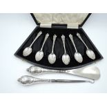 A cased set of six silver coffee spoons having moulded terminals, Birmingham 1923, W H Haseler