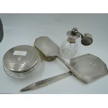 Four silver dressing table items including cut glass perfume atomiser with silver fitments, cut