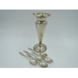 An Edwardian silver stem vase of trumpet form having frilled rim, tapered stem and weighted base,