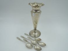 An Edwardian silver stem vase of trumpet form having frilled rim, tapered stem and weighted base,