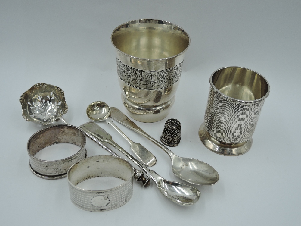 A small selection of HM silver including a beaker having engine turned...