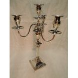 A large Edwardian silver four light candelabrum having a detachable top with trio of scroll branches