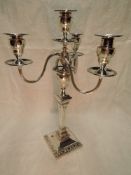 A large Edwardian silver four light candelabrum having a detachable top with trio of scroll branches
