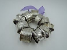 Eleven HM silver napkin rings of various forms including pairs, approx 178g