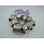 Eleven HM silver napkin rings of various forms including pairs, approx 178g