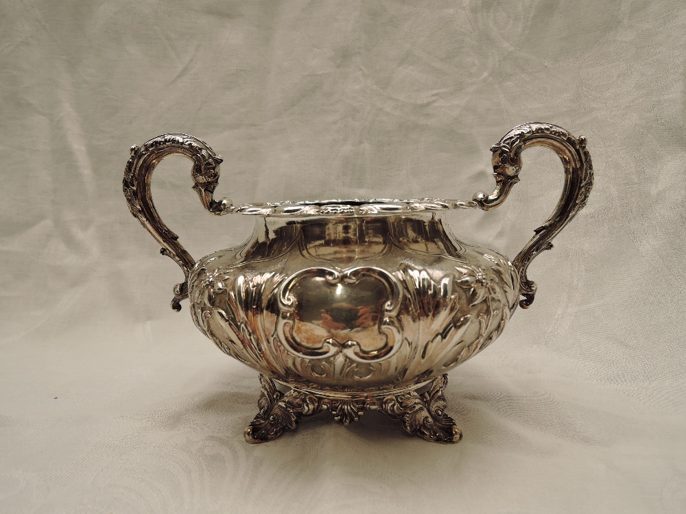 A Victorian Irish silver four piece matched tea set of goad form having extensive repousse and - Image 5 of 10