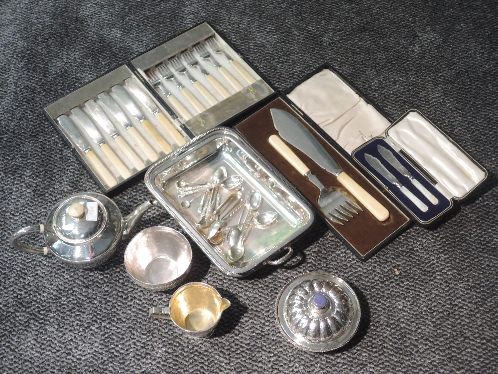 A selection of silver plate including an Artisan made three piece bachelor tea set, cased fish