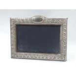 A silver photograph frame having blue velvet easel back, London 1991, Keyford Frames Ltd, approx