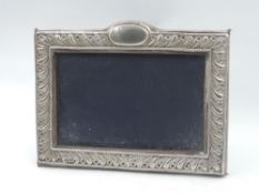 A silver photograph frame having blue velvet easel back, London 1991, Keyford Frames Ltd, approx