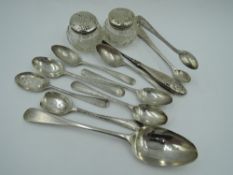 A small selection of HM silver including teaspoons, Georgian dessert spoon, silver topped dressing