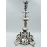 A Victorian Egyptian Revival style candle stick having crown style sconce above beaded drip pan to