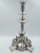A Victorian Egyptian Revival style candle stick having crown style sconce above beaded drip pan to