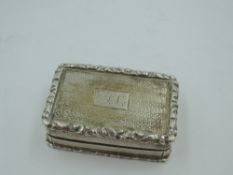 A Georgian silver vinaigrette of rectangular form, having cast edges, monogrammed cartouche, and