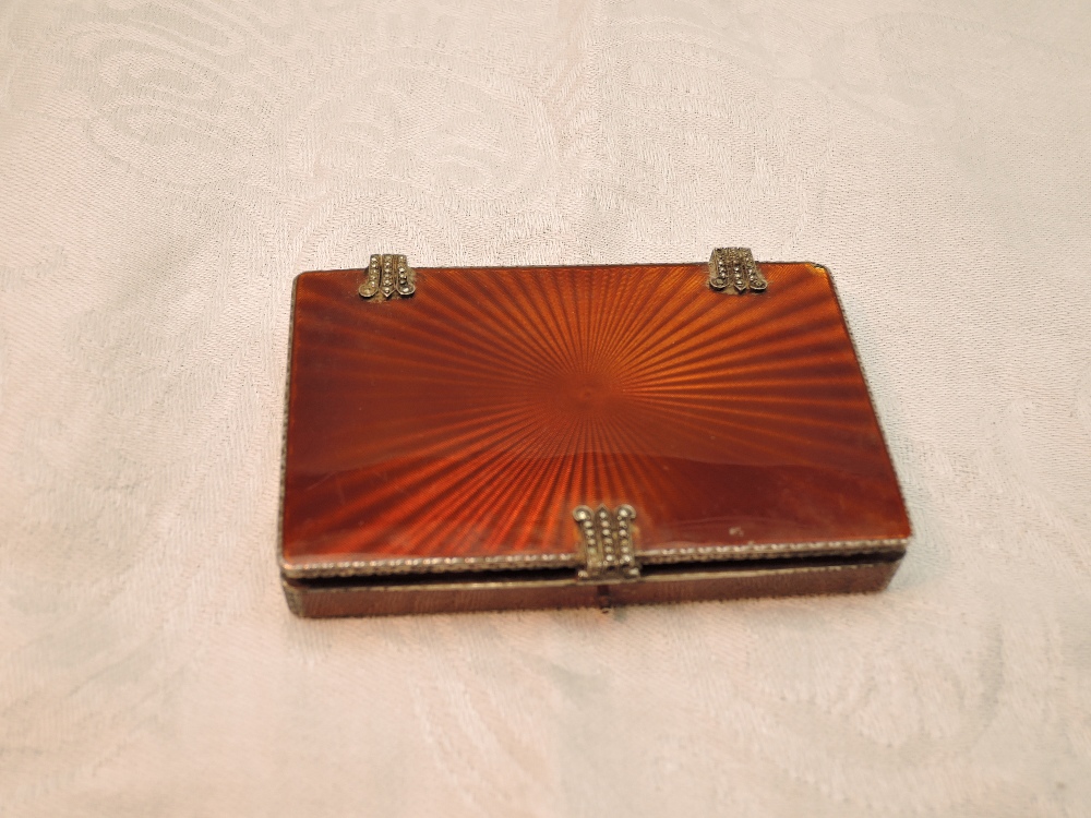 A continental silver card box having tan coloured star burst enamel...