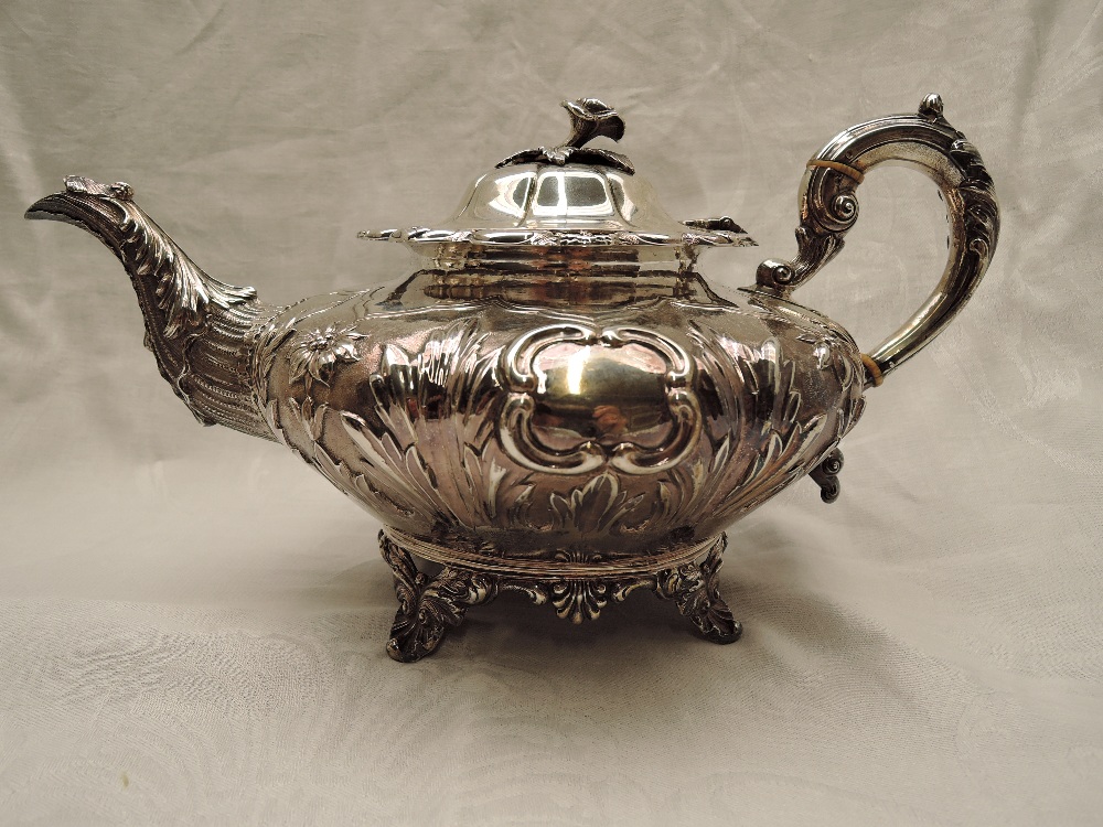 A Victorian Irish silver four piece matched tea set of goad form having extensive repousse and - Image 2 of 10