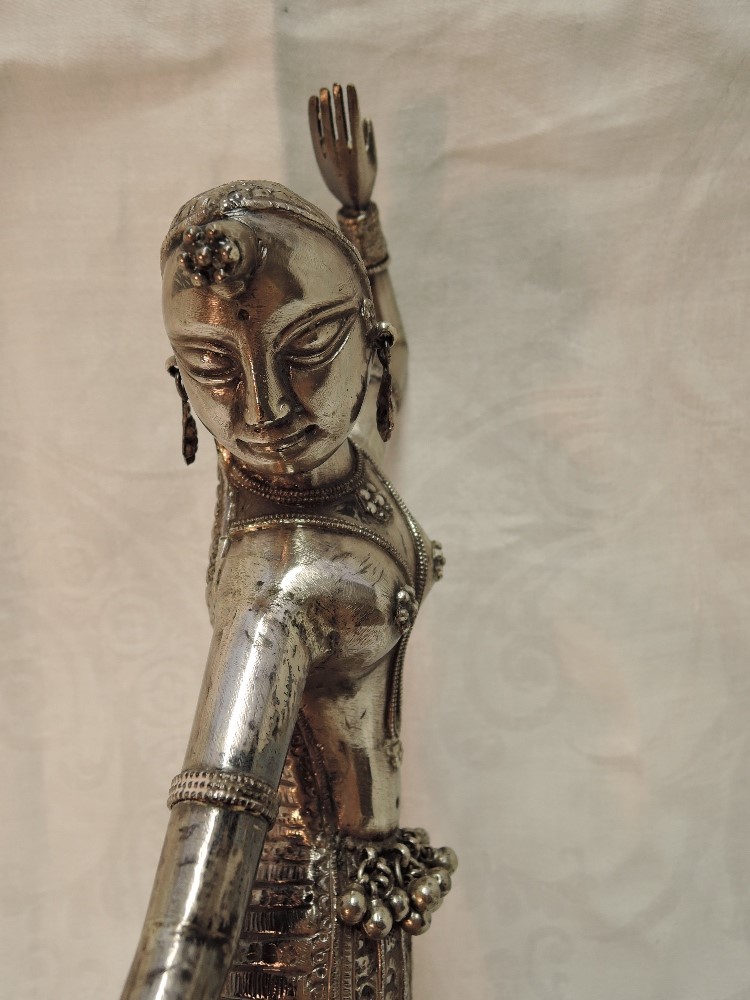 A white metal study of a Far Eastern dancing figurine having moulded and engraved decoration on a - Image 4 of 5